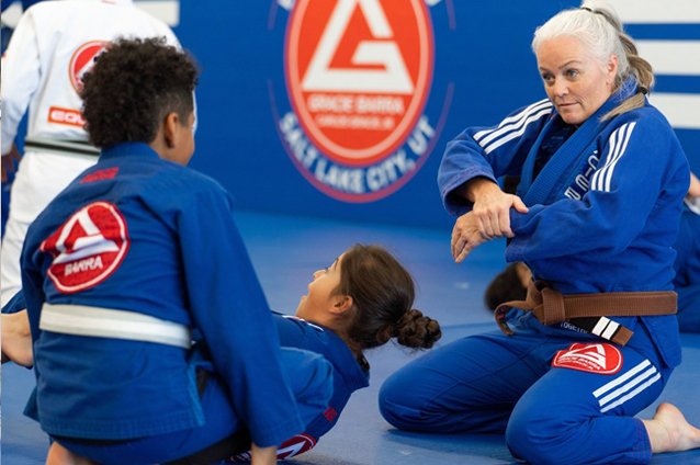 Professor Andrea Warner teaching BJJ to some kids at Gracie Barra Salt Lake City