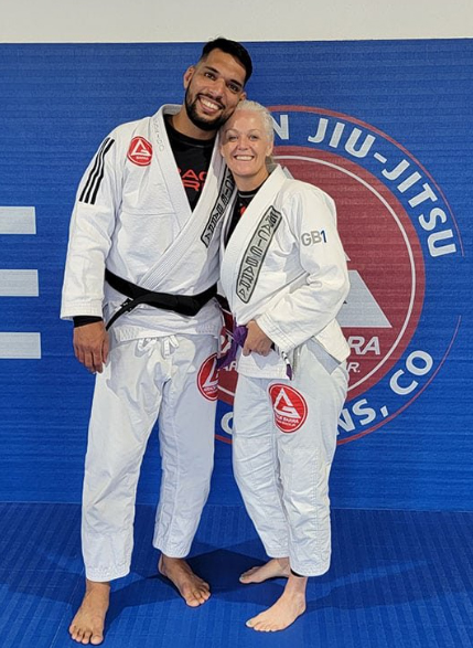 Prof Seidler Rodrigo and Prof Andrea Warner posing at Gracie Barra Fort Collins, CO