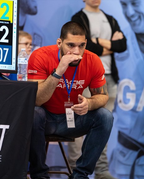 A portrait of Prof. Seidler Rodrigo coaching a student in a competition.