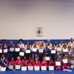 Kids Jiu-Jitsu team receiving a new grade on their belt