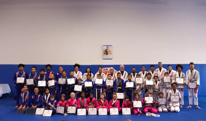 Kids Jiu-Jitsu team receiving a new grade on their belt